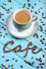 Cup of coffee on a wooden background