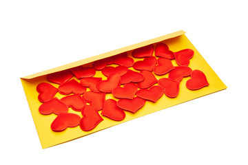 Many red hearts on a yellow envelope. Valentine's Day and March 8 concept