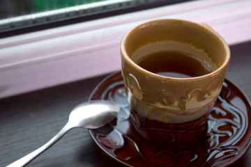Cup of tea. Black tea on the kitchen table