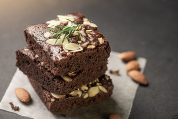 Fototapeta na wymiar A stack of chocolate brownies on dark plat background ,homemade bakery and dessert.