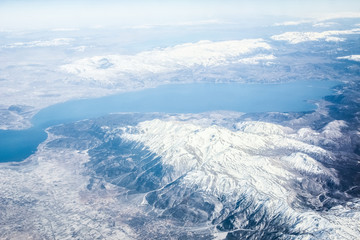 Fototapeta premium Beautiful earth and sea from a window airplane background