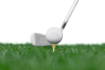 Golf Ball on Tee and Club on Golf Course