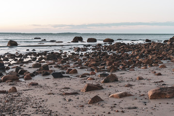 Fototapeta na wymiar Motion blur rocky Buzzards Bay beach