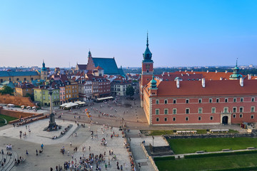 Naklejka na ściany i meble Warsaw, Poland - August 11, 2017: Beautiful aerial panoramic view of Plac Zamkowy square in Warsaw, with historic building, including Sigismund III Vasa Column, and people at summer sunset, Warsaw, Po