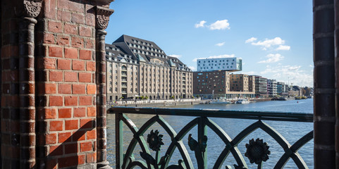 Panoramic view from Oberbaum bridge, Kreuzberg east side, Berlin, Germany. Blue sky, ships and city background. © viperagp