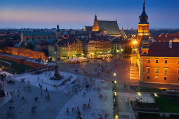 Fototapeta na wymiar Warsaw, Poland - August 11, 2017: Beautiful aerial night panoramic view of Plac Zamkowy square in Warsaw, with historic building, including Sigismund III Vasa Column, and people at warm summer night W