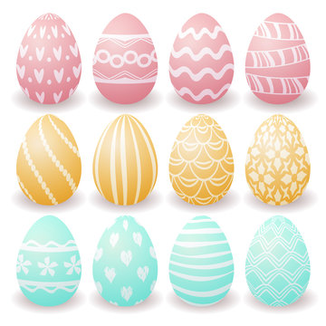 set of pink, yellow and blue Easter eggs with white patterns