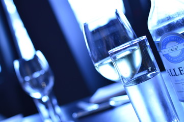 test tubes with blue liquid on black background