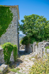 Medieval stone fortress is located high in the mountains.