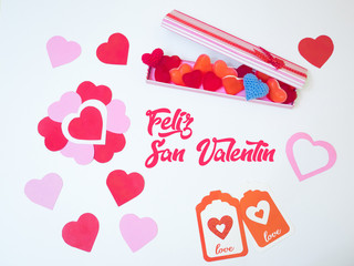 San Valentine´s day decoration card made with red and pink paper hearts and a gift box