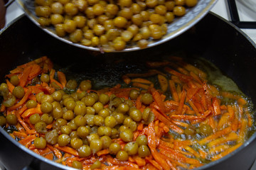 Peas in a pan with chopped carrots