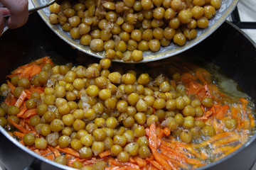 Peas in a pan with chopped carrots