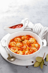 Fish meatballs in tomato sauce with carrot
