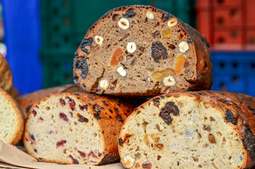 Sliced fresh homemade bread baked with dried apricots, prunes and pistachios.  Healthy food.
