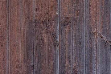 The texture of shabby paint on a wooden wall