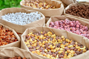 Nuts in sweet shells in paper boxes for sale in the market.