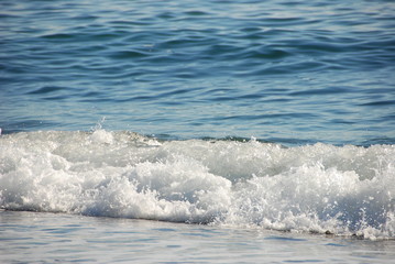 Waves on the seashore. Autumn in the Crimea. Travels. Golden autumn. Sunny day.
