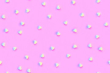 Pink repeating background with hearts in trendy colors. Seamless pattern.