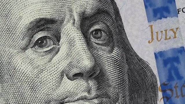 Benjamin Franklin on US 100 dollar bill slow rotating. Stock video footage