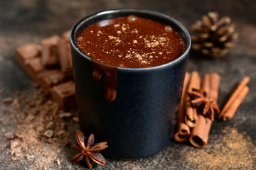Homemade spicy hot chocolate in a black cup.