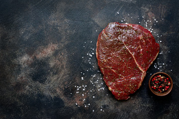 Raw organic marinated beef steak.Top view with copy space.