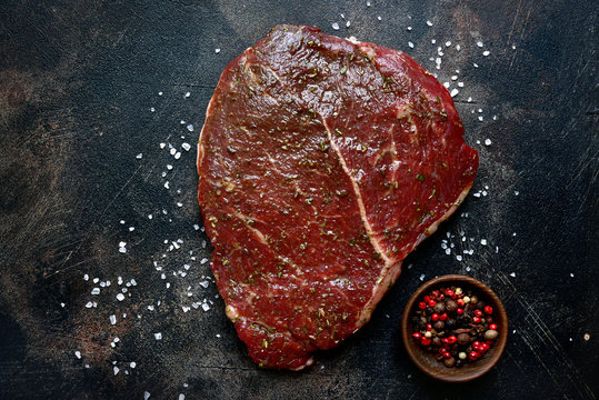 Raw organic marinated beef steak.Top view with copy space.