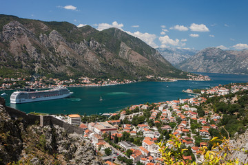 Fototapeta na wymiar Scenic view of the historic Old Town of Kotor, Kotor Bay and The cruise ship departing from Lovcen Mountain, Montenegro, Balkans