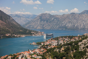 Fototapeta na wymiar Scenic view of the historic Old Town of Kotor, Kotor Bay and The cruise ship departing from Lovcen Mountain, Montenegro, Balkans