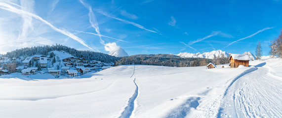 Wide panoramic view of winter landscape with snow covered trees and houses in Seefeld in the Austrian state of Tyrol. Winter in Austria - Powered by Adobe
