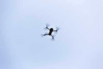 View of a drone flying on white background