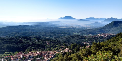 Corfu and morning mist