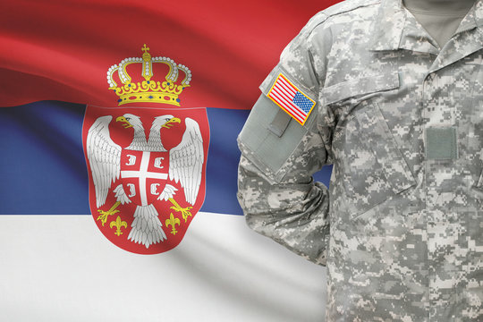 American soldier with flag on background - Serbia