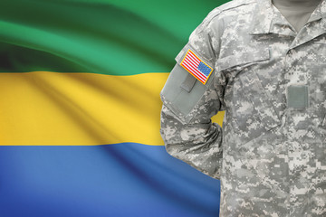 American soldier with flag on background - Gabon