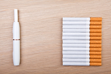 electronic smoke device cigarette wooden table nobody 