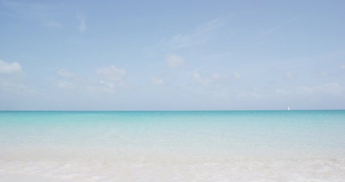 Beach background. Perfect white sand beach with turquoise water. RED EPIC SLOW MOTION.
