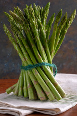 Asparagus bunch on a table upright on a cloth