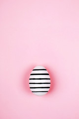 Easter egg on pink. Flat lay style.