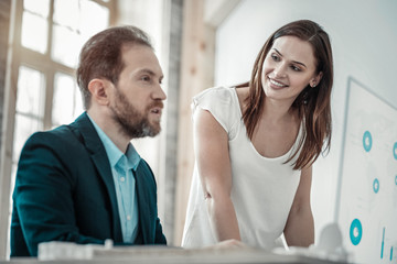 Bearded businessman asking piece of advice from his wife