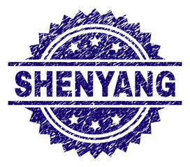 SHENYANG stamp seal watermark with distress style. Blue vector rubber print of SHENYANG label with dirty texture.