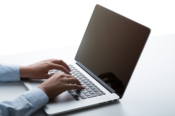 Closeup of a Businesswoman Typing on a Laptop