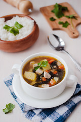 Healthy vegan veggie soup with tofu, potatoes and seaweeds