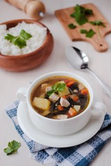 Healthy vegan veggie soup with tofu, potatoes and seaweeds