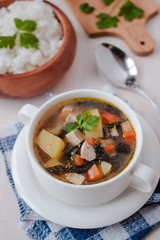 Healthy vegan veggie soup with tofu, potatoes and seaweeds