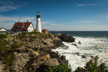 Fototapeta na wymiar Tourists Enjoy Portland Head Lighthouse and Waves