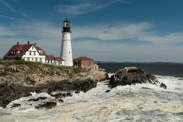 Fototapeta na wymiar Frothy Waves at Portland Head Lighthouse