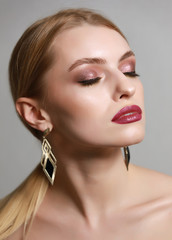 Fototapeta premium Fashion model portrait with beautiful makeup and closed eyes