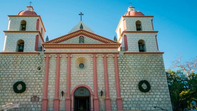 Timelapse of Tourists at Historic Church in Santa Barbra -Pan Left-