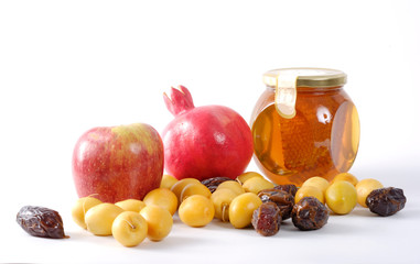 Apples, Honey, pomegranate, and dates,