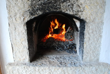 Traditional wood fire oven. Burning flames in fireplace 