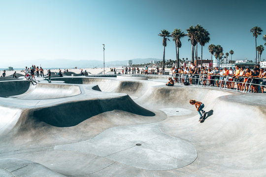 June 10, 2018. Los Angeles, USA. Venice beach skate park by the ocean. People skating at the skatepark showing different tricks. 
